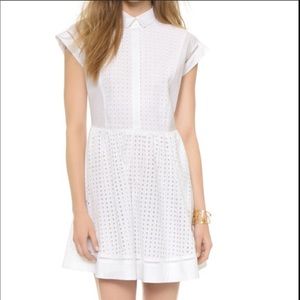 Beautiful white pinafore dress with eyelet detail!